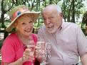 Elderly couple enjoying refreshments